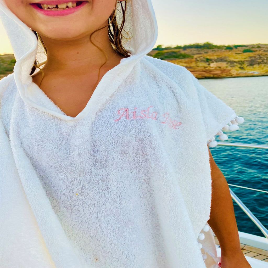 Terrycloth Poncho With Pom Poms